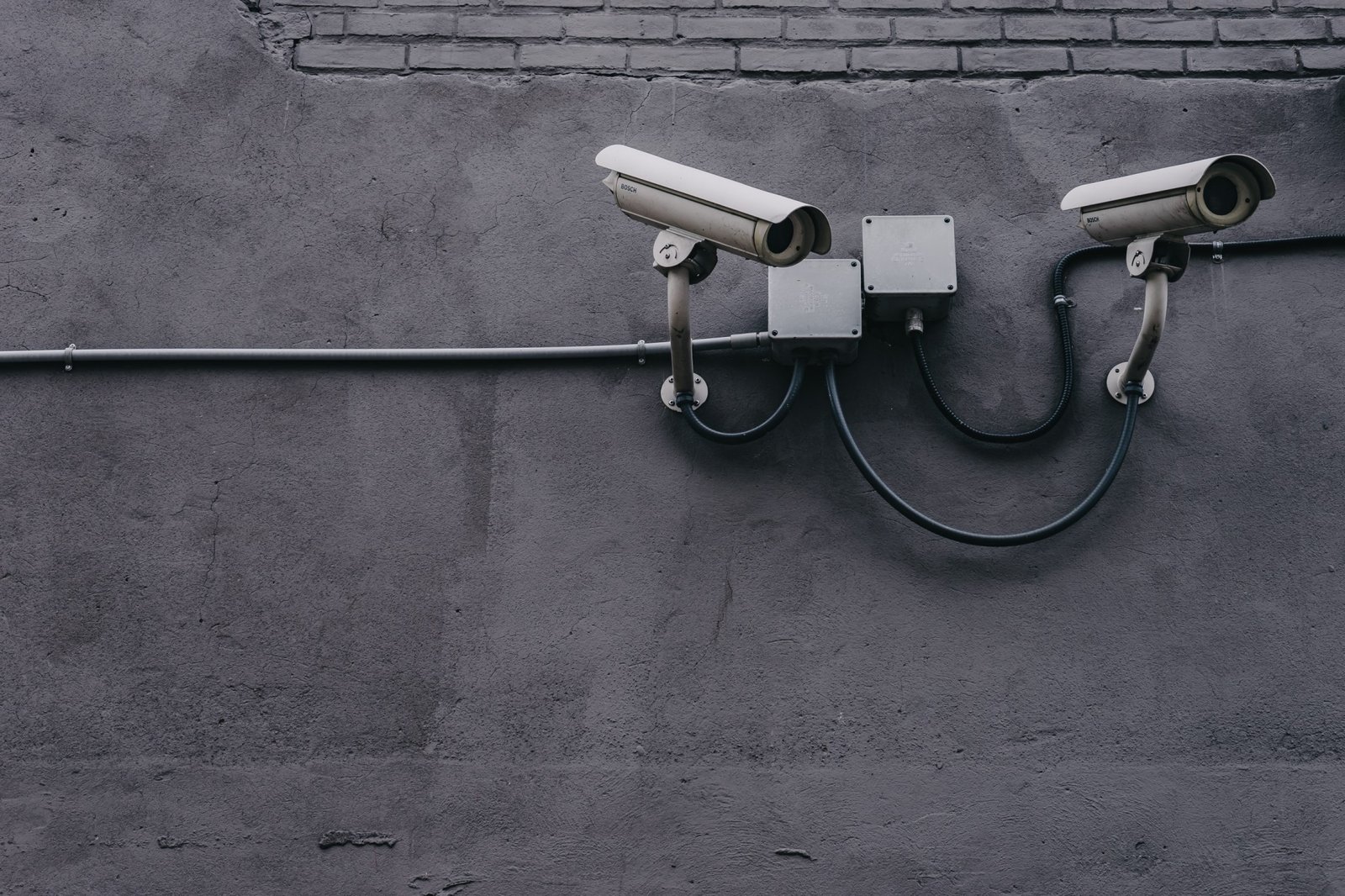 security cameras on concrete wall